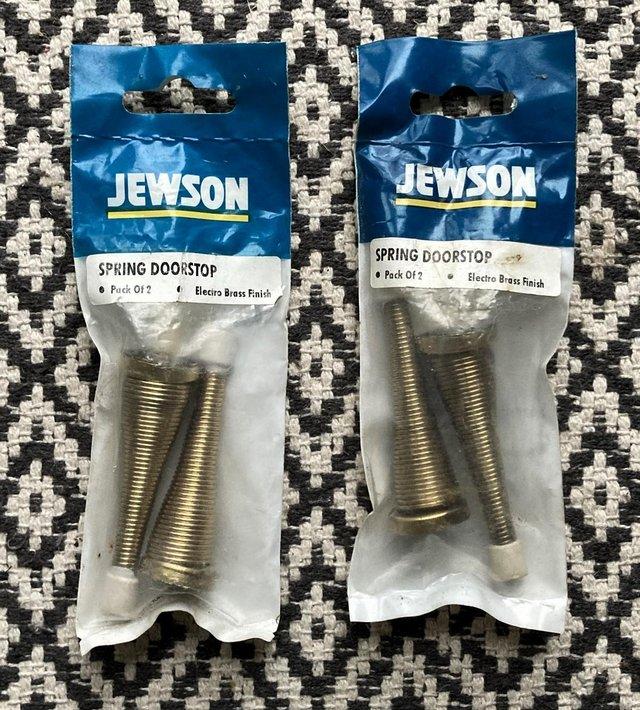Preview of the first image of BNIB SPRING DOORSTOP DOOR STOP BRASS FINISH JEWSON SEALED.