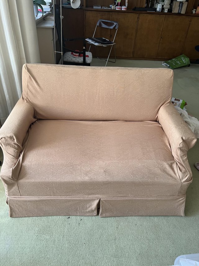 Preview of the first image of A two seater sofa bed upholstered.