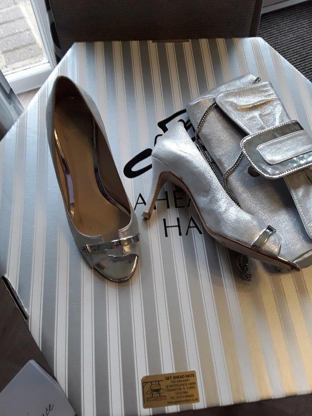Preview of the first image of Matching Lisa Kay bag and shoes worn by mother of the groom.