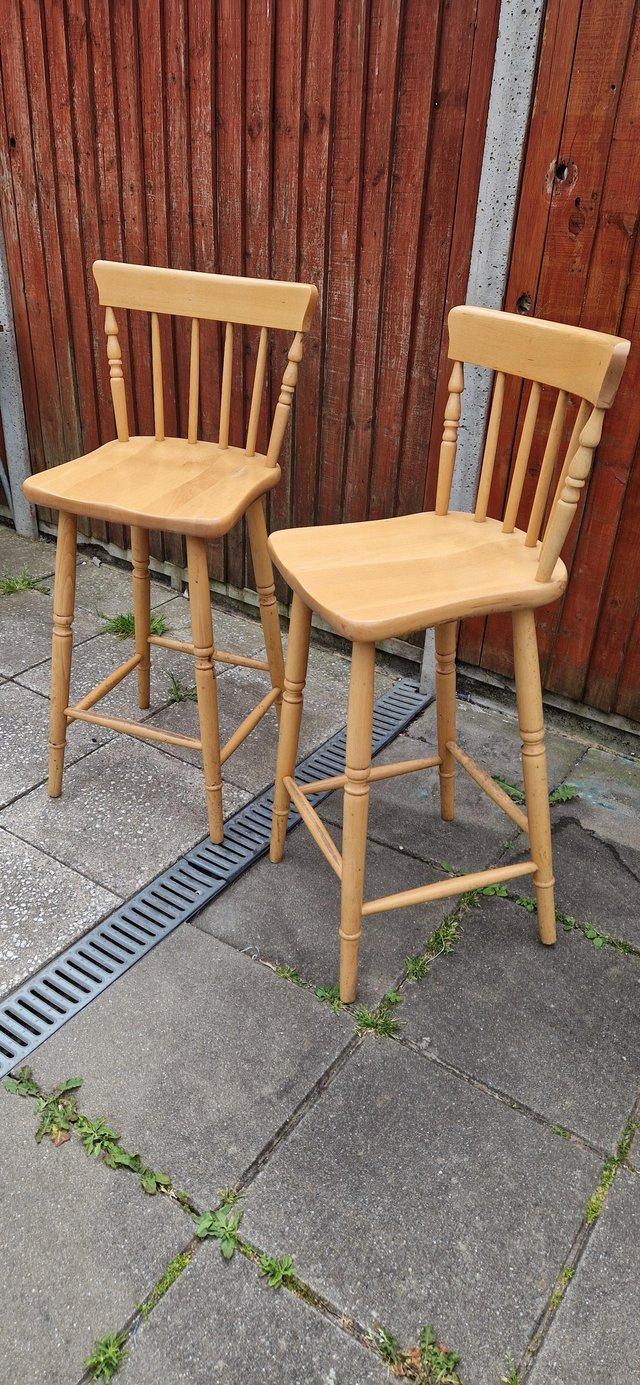 Preview of the first image of 2 wooden bar stools/ high chairs.