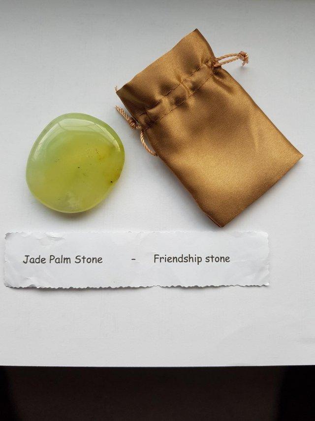 Preview of the first image of A jade palm stone also known as a friendship stone.