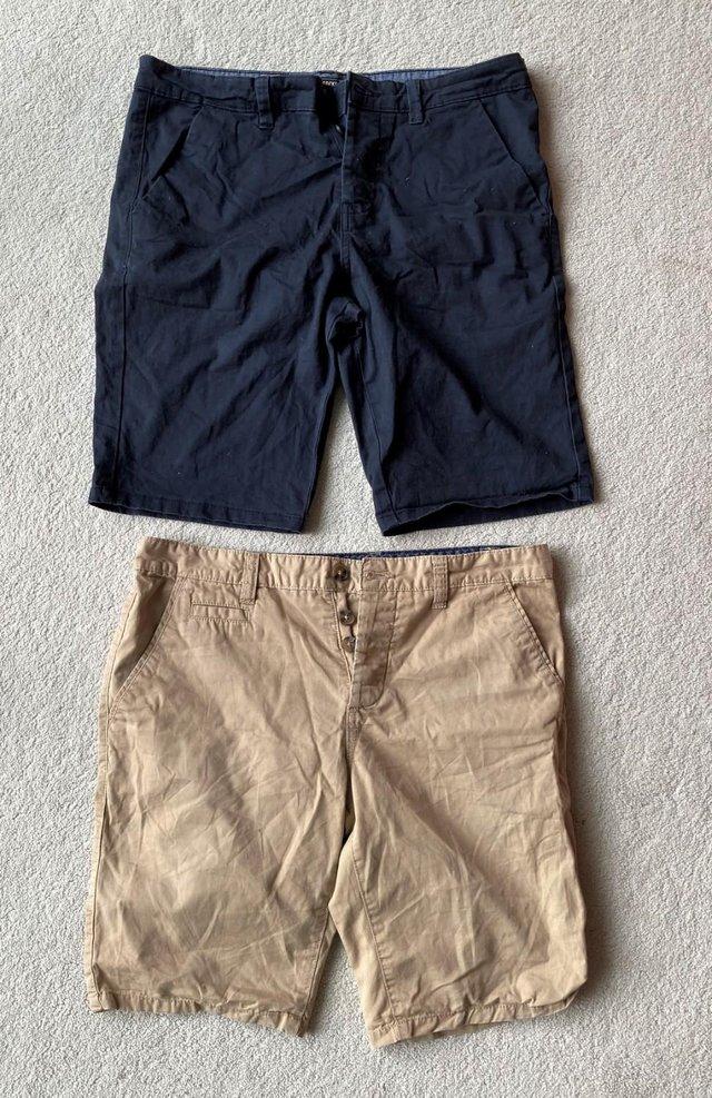 Preview of the first image of BUNDLE CHINO SHORTS TAN KHAKI SHORT PANTS 32" WAIST BLUE.