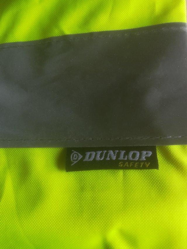 Preview of the first image of Mens high visibility water proof trousers.
