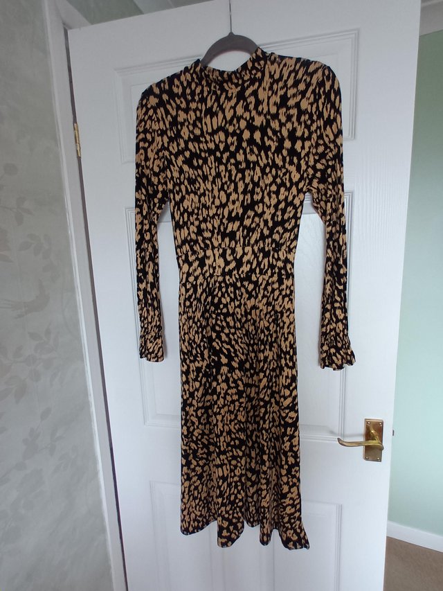 Preview of the first image of Black and beige midi length dress by TU - size 10/12.
