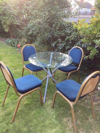 Image 1 of Portable solid glass table and 4 chairs