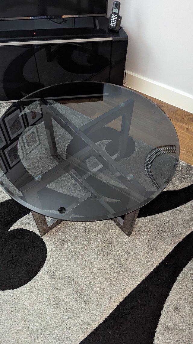 Preview of the first image of Beautiful Black round glass coffee table.