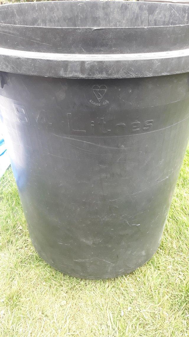 Preview of the first image of 94 litre black dustbin with lid.