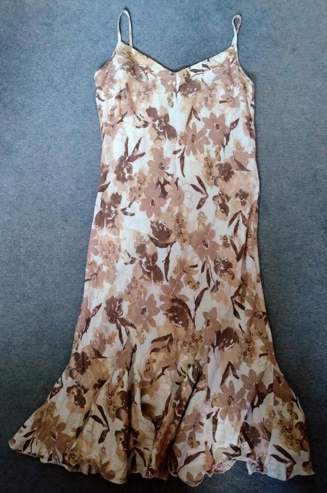 Preview of the first image of Marks & Spencer Per Una beige floral linen strappy mididress.