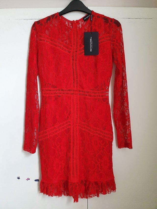 Preview of the first image of Red Lace  Bodycom Dress Size 10.