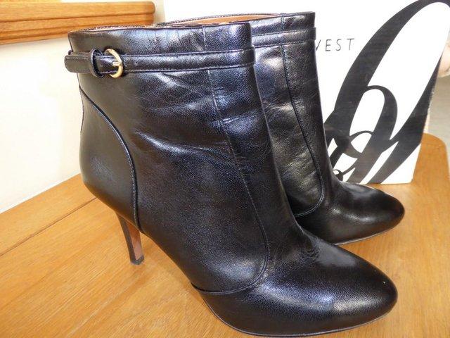 Preview of the first image of Black Leather Nine West Ankle Boots Size 7.