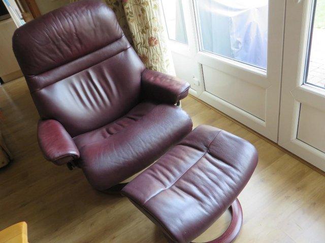 Preview of the first image of Stressless recliner leather chair and footstool Dark brown.
