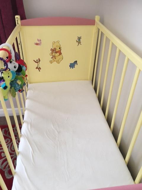 Preview of the first image of Cot with mattress; 4 ft x 2 ft with one drop down side.