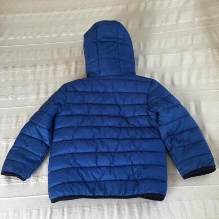 Image 1 of Tissaia blue packaway jacket + bag. Hood, padded. Age 6 yrs.