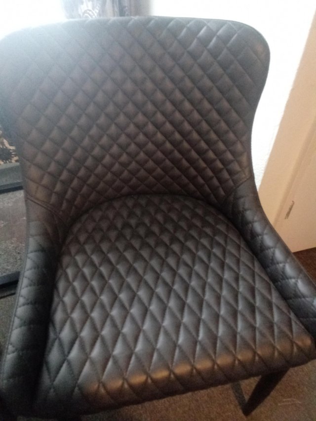 Preview of the first image of Dunelm grey faux leather chairs excellent condition.