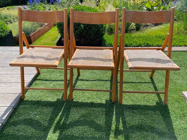 Preview of the first image of Vintage Rattan Habitat 1980s Folding Chair Set Of Three.