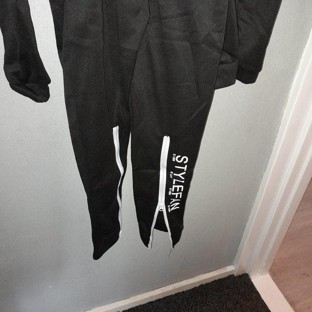 Preview of the first image of Style fan two piece set with zips in the back of hoodie.