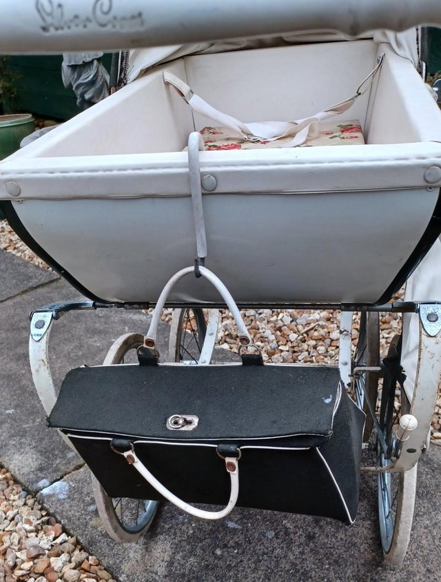 Preview of the first image of VINTAGE SILVER CROSS DOLLS PRAM.