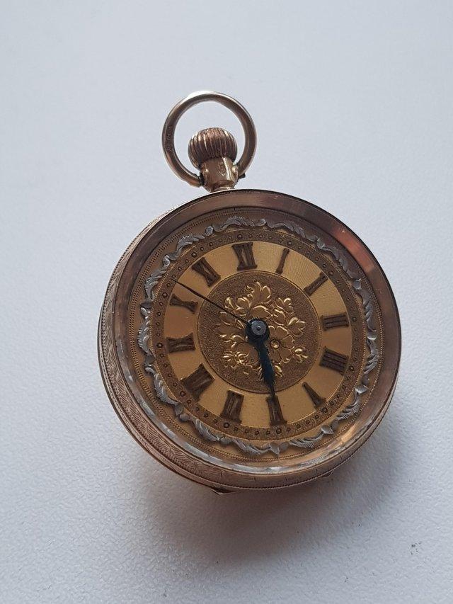 Preview of the first image of Antique 1915 12 carat gold ornate pocket watch.