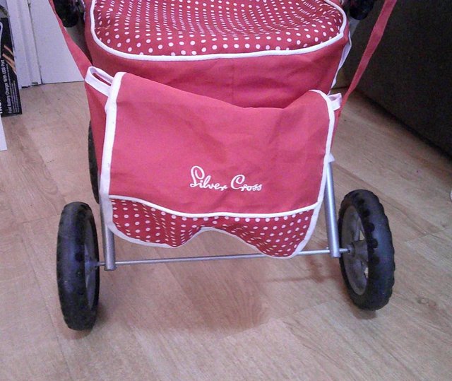 Preview of the first image of Red Silver Cross Dolls Pram, 3+ yrs.