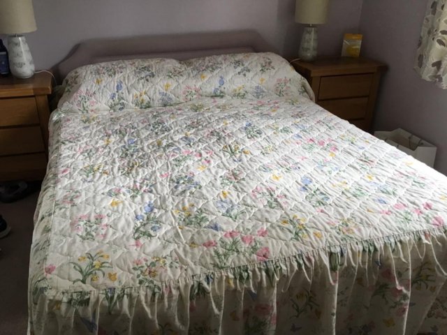 Preview of the first image of Pretty floral curtains with matching bedspread.