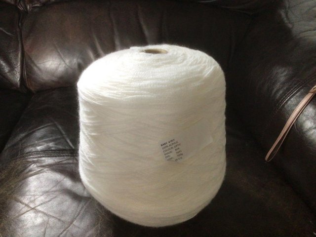 Preview of the first image of One cone of baby 4ply yarn  white.