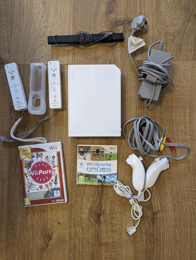 Preview of the first image of Nintendo Wii with accessories and 2 remotes.