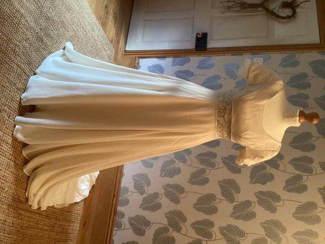 Preview of the first image of Handmade wedding dress, ivory silk, size 6.