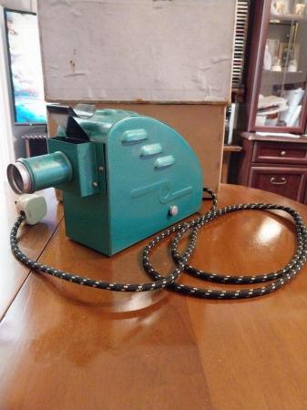 Image 1 of 1940 / 50 s projectorand tin of rolled up films