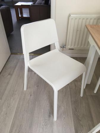Image 1 of Wood table and 4 plastic chairs