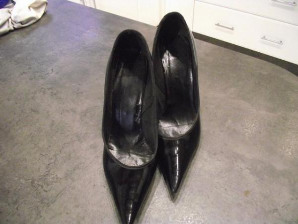 Image 2 of A pare of black patent leather high heels