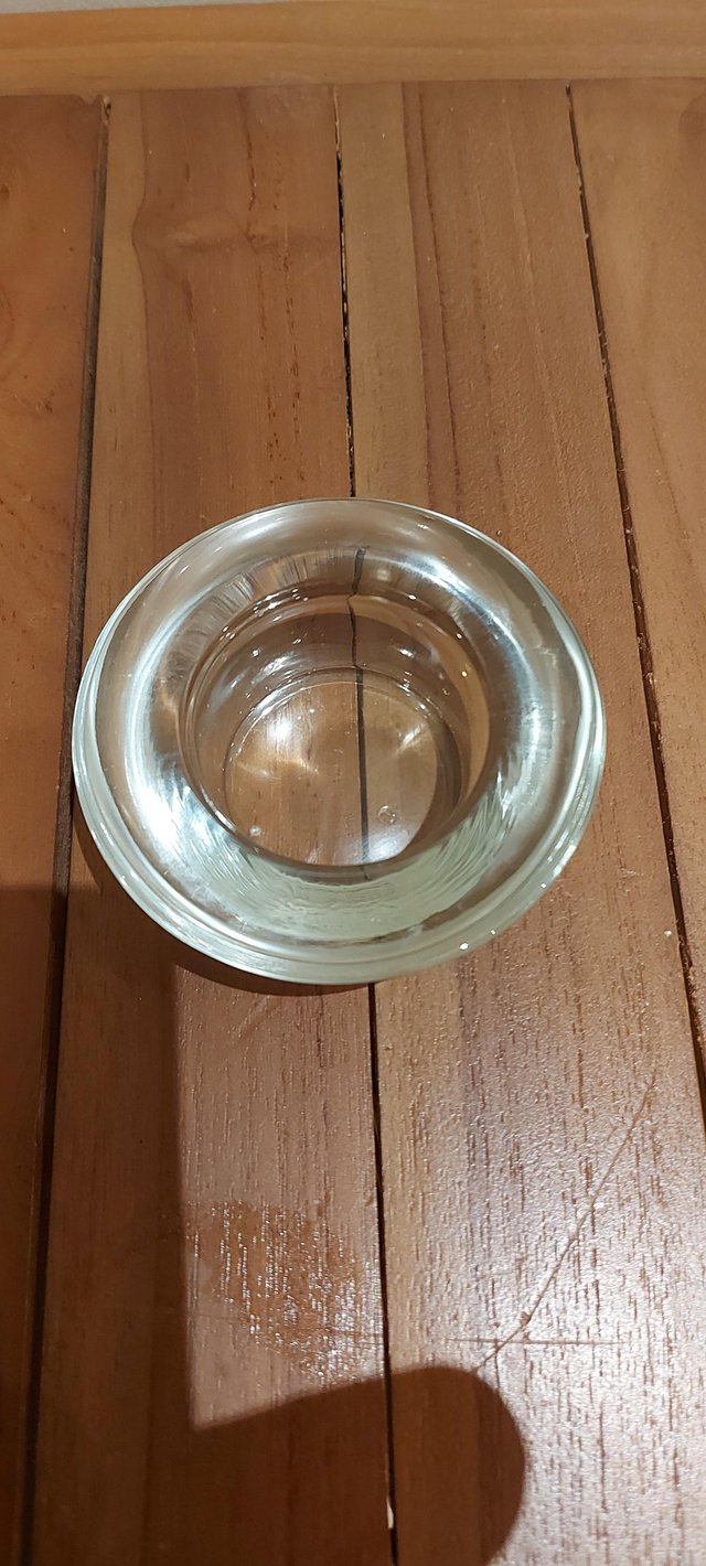 Preview of the first image of Clear glass tea lights, 64 no., good condition.