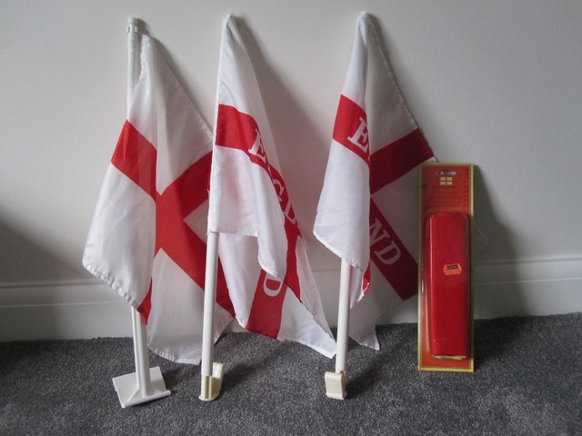 Preview of the first image of 4 England flags 1 new in box.