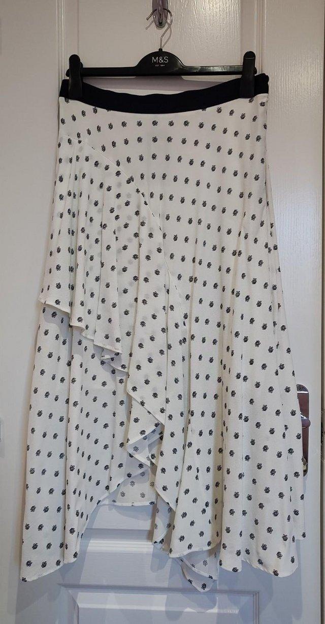 Preview of the first image of New with tags Marks and Spencer Soft White Skirt Size 12 Reg.
