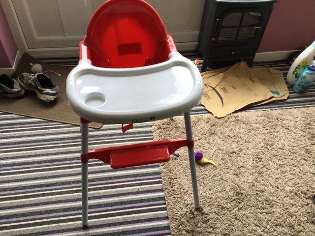 Preview of the first image of Child’s Red and White High/Low chair.