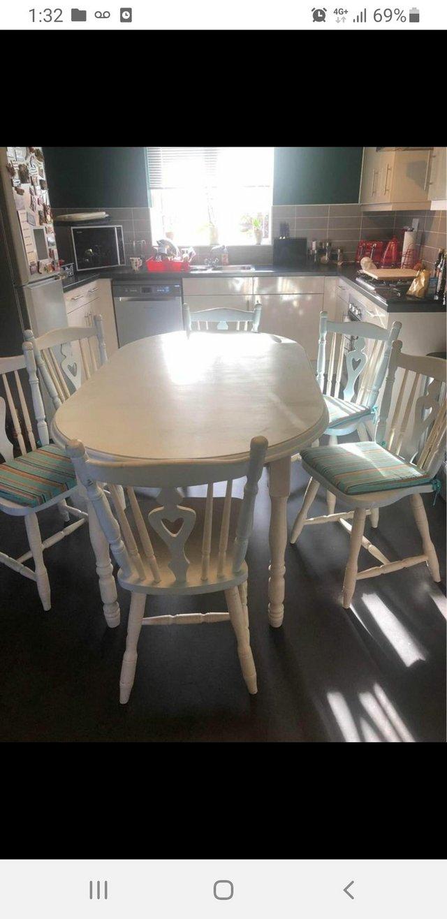 Preview of the first image of Country style farmhouse dining table and chairs.