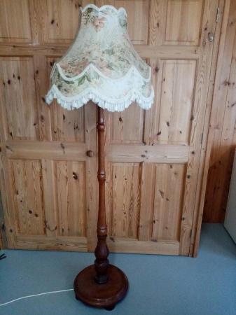 Image 1 of wooden lamp stand with heavy round base
