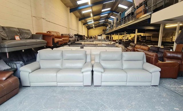 Preview of the first image of Italian Moreno grey leather electric pair of 3 seater sofas.
