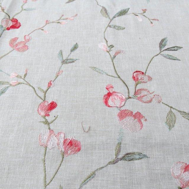 Preview of the first image of Fabric remnant beige background with embroidered design.