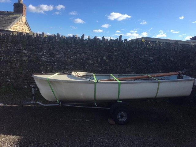 Preview of the first image of Toddy 12' fibreglass dinghy with sails, outboard & trailer.