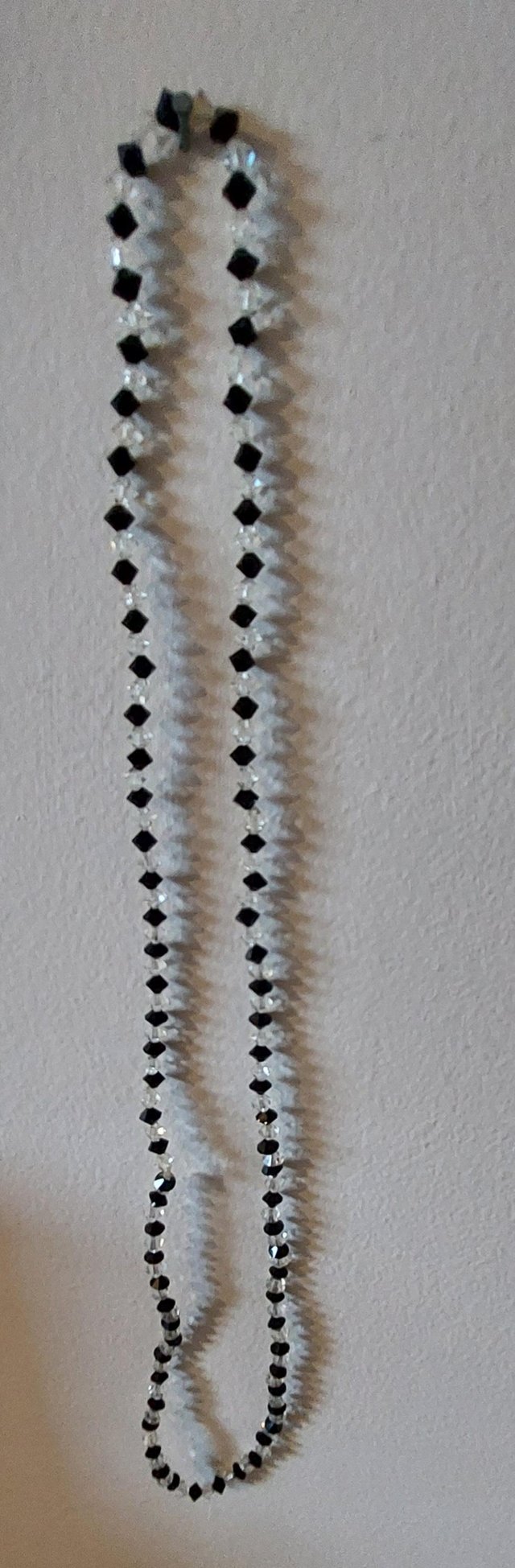Preview of the first image of Costume jewellery,  clear and black necklace.