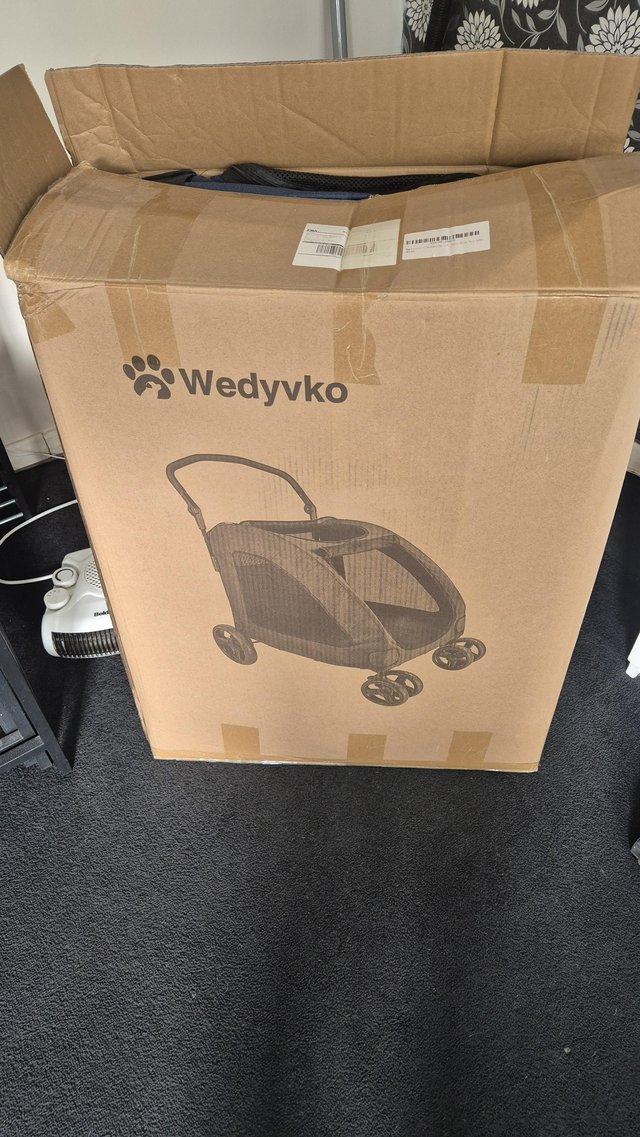 Preview of the first image of Dog stroller.blue with black net..