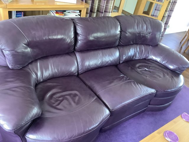 Preview of the first image of Leather purple sofa with end seat that turns.