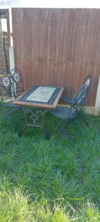 Image 2 of Heavy cast iron table and 4x chairs
