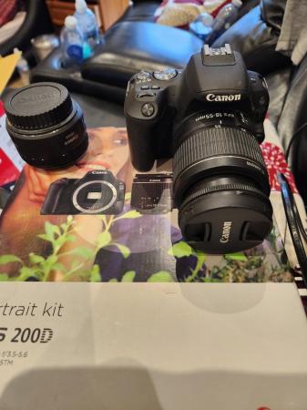 Image 1 of Canon camera with 3 lenses in box mint co
