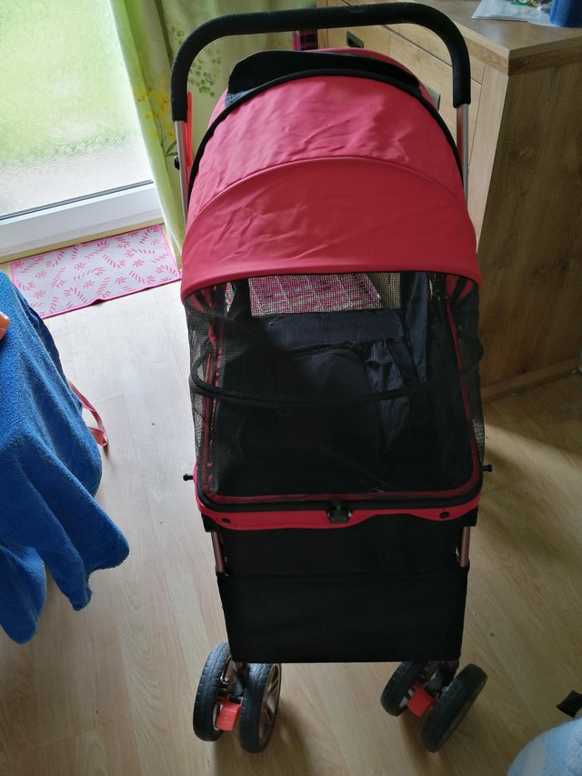 Preview of the first image of Red large collapsible dog pram.
