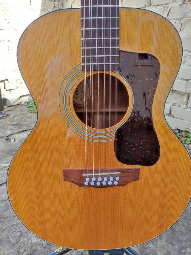 Preview of the first image of 1977 Guild F-112 acoustic guitar.
