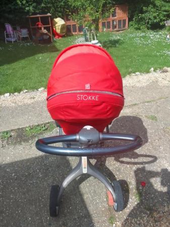 Image 1 of STOKKE push chair in red