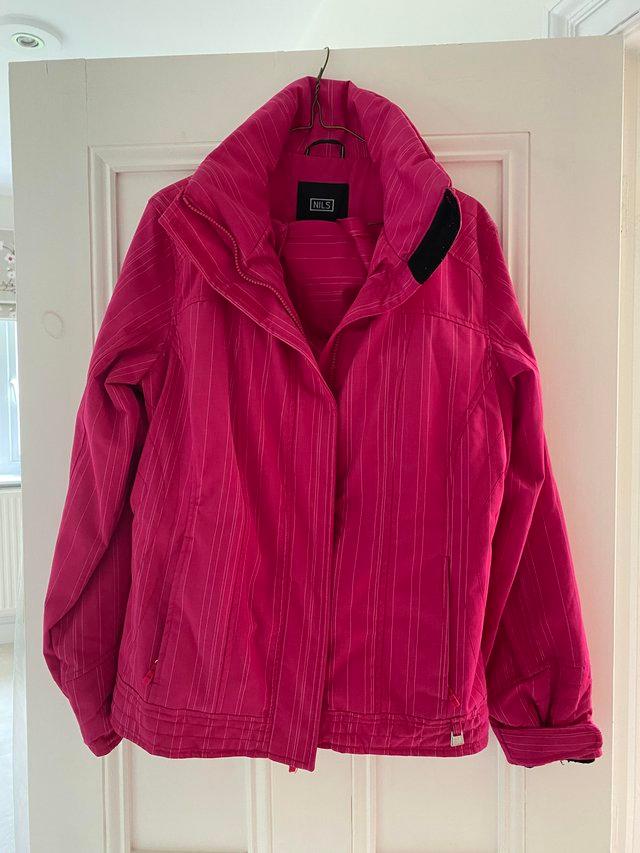 Preview of the first image of Nils ladies cerise ski jacket with hood…size 10.
