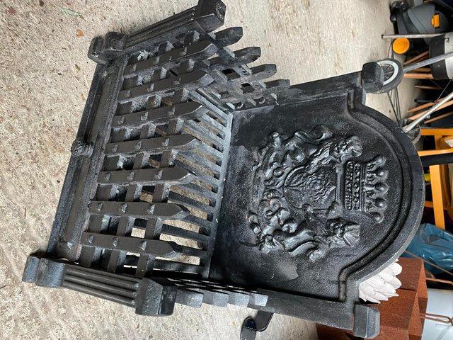 Preview of the first image of Black Wrought Iron Fire grate and back.