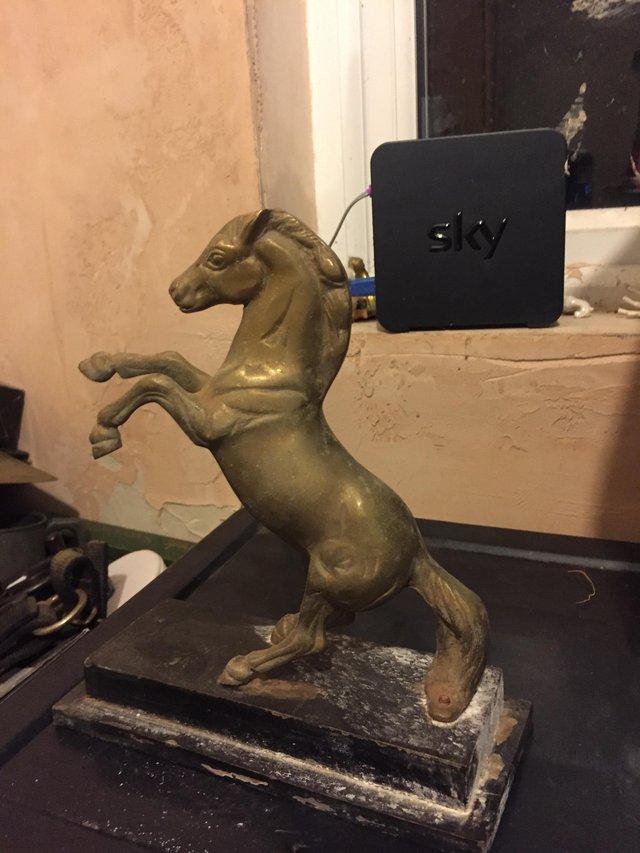 Preview of the first image of Brass figurine of rearing horse on marble base.